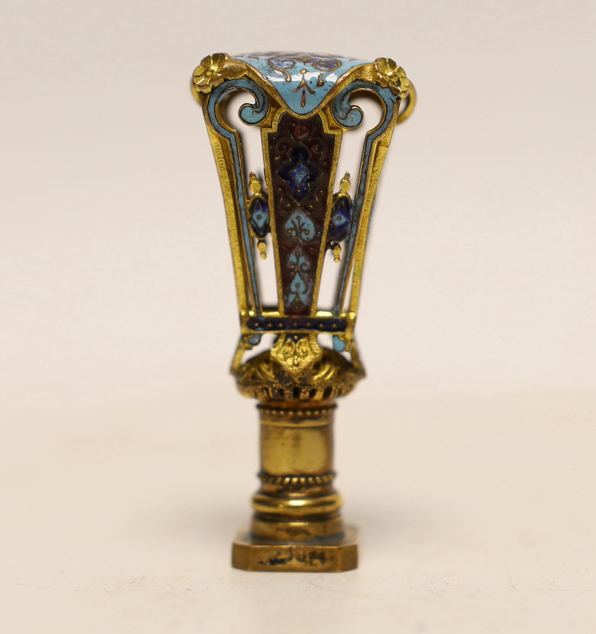 A late 19th century French cased gilt metal and champleve enamel desk seal, 5.5cm high